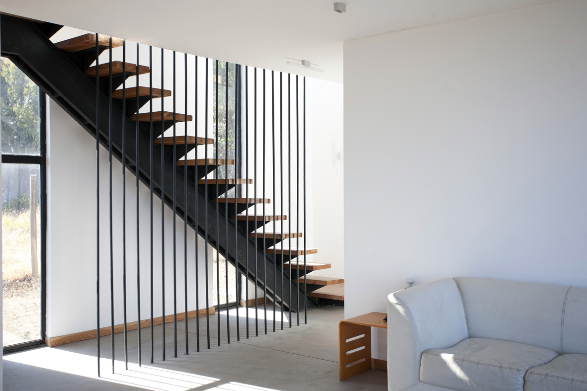 Casa SIP — interior estar-comedor con luz natural, arquitecto Alejandro Soffia